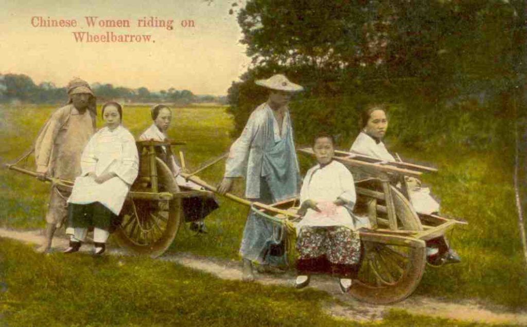 Chinese Women riding on Wheelbarrow