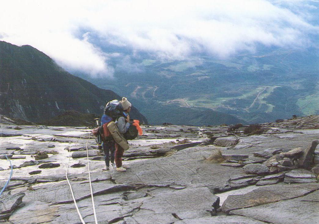 Mt. Kinabalu, Climber on summit plateau (13,000 ft.) (Malaysia)