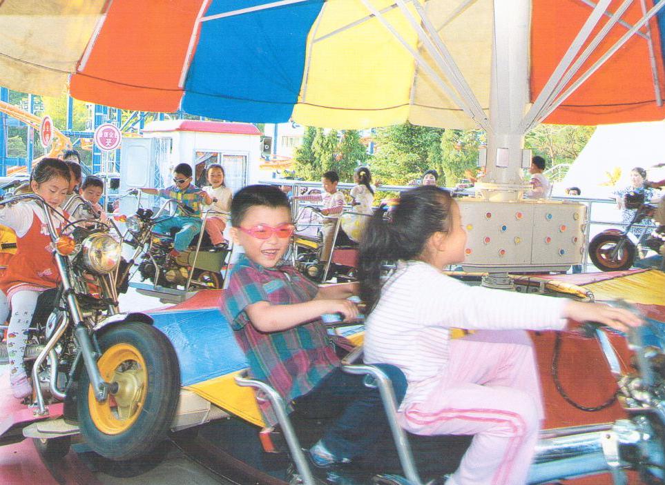Pyongyang, Kaeson Youth Park, children on cycles (DPR Korea)