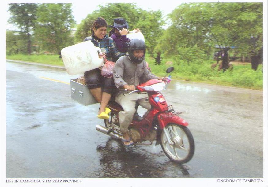 Siem Reap Province, motorcycle and containers (Cambodia)