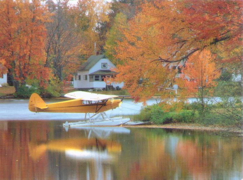 Airplane on lake in autumn